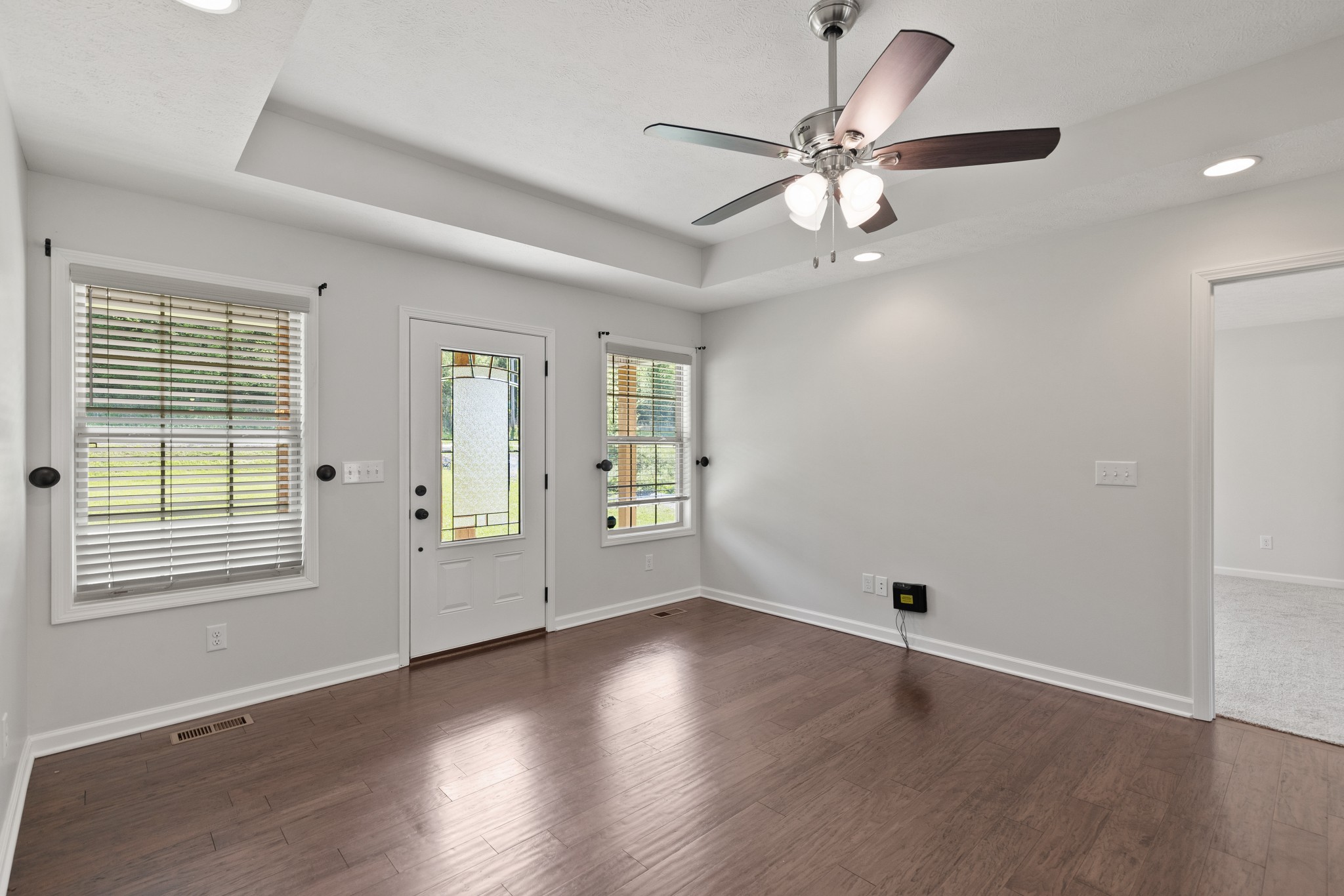 1821 Rock Bridge Road Bethpage, TN 37022 - Photo 6 of 31 a view of an empty room with wooden floor and a window