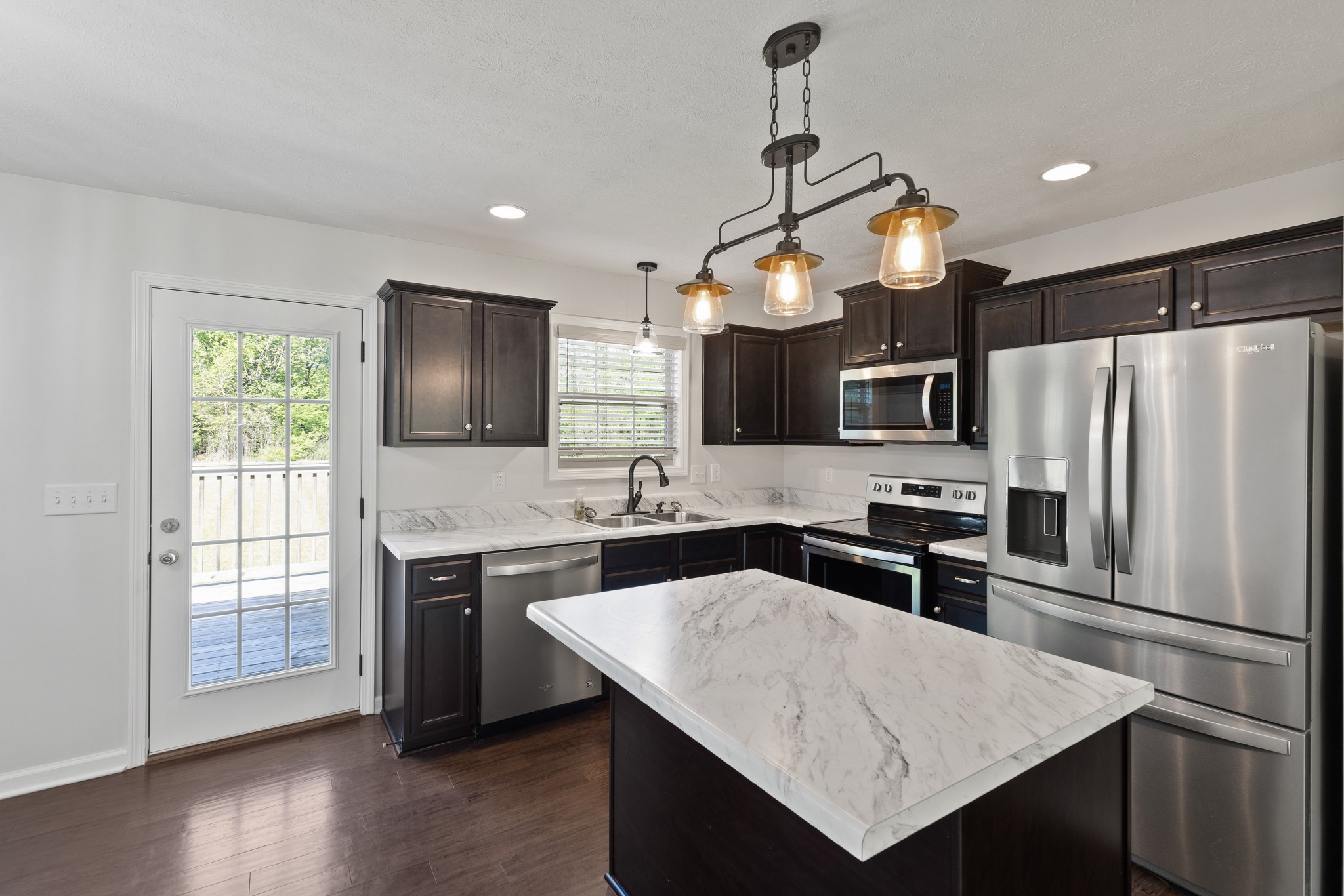 1821 Rock Bridge Road Bethpage, TN 37022 - Photo 9 of 31 a kitchen with a refrigerator a sink and a stove