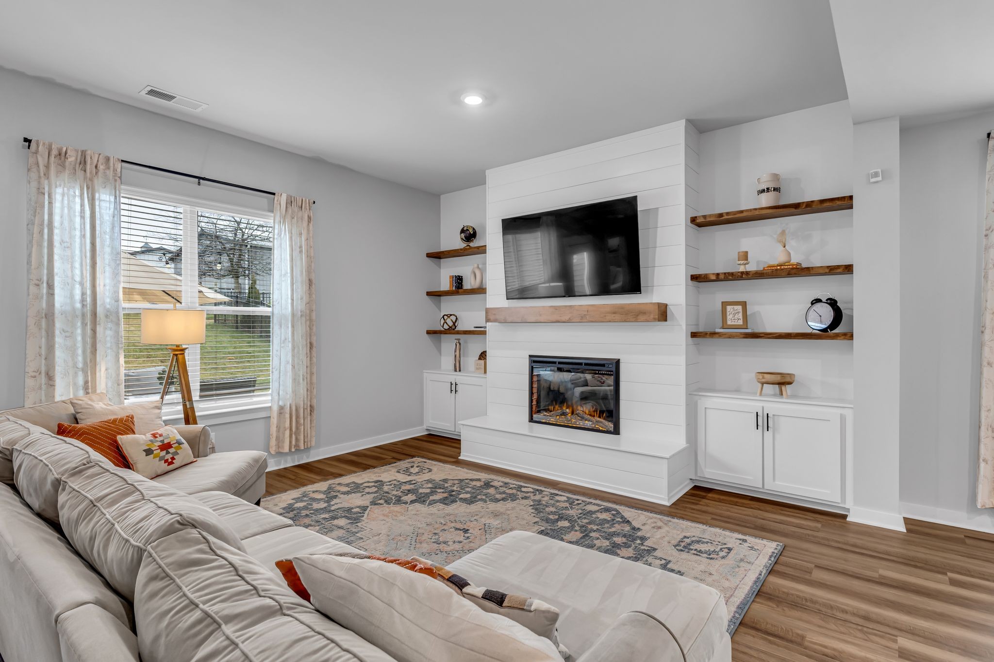 417 Irwin Way Spring Hill, TN 37174 - Photo 11 of 43 a bedroom with furniture and a fireplace