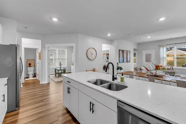 a kitchen with counter top space a sink and cabinets
