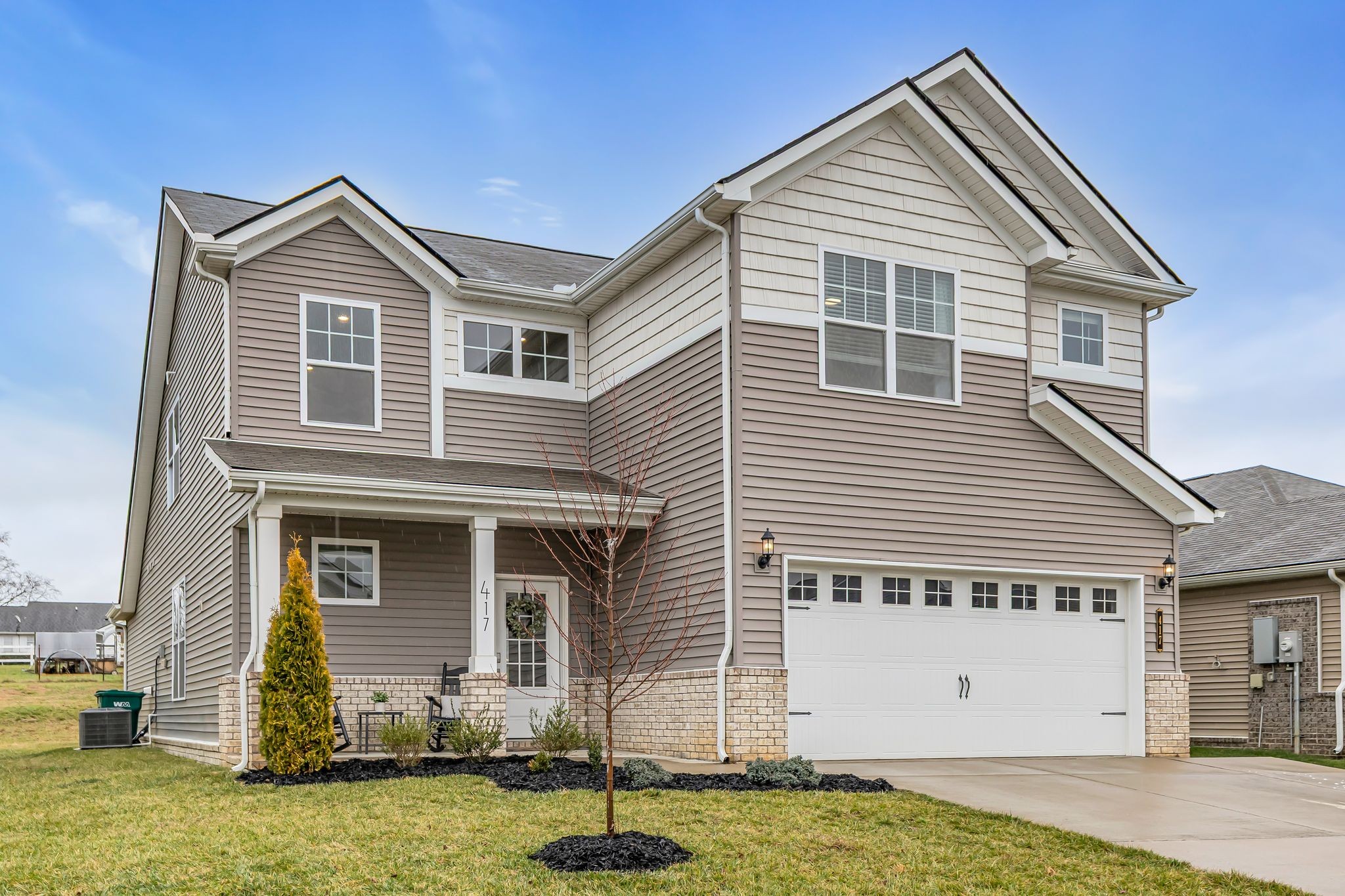 417 Irwin Way Spring Hill, TN 37174 - Photo 2 of 43 a front view of a house with a yard