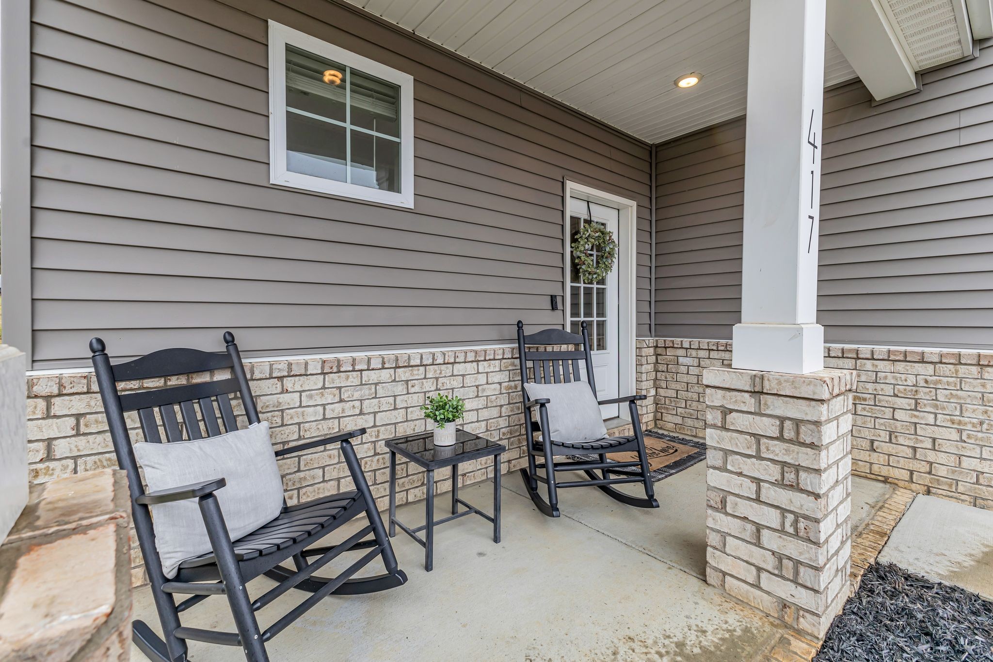 417 Irwin Way Spring Hill, TN 37174 - Photo 3 of 43 a view of a chairs and table in the back