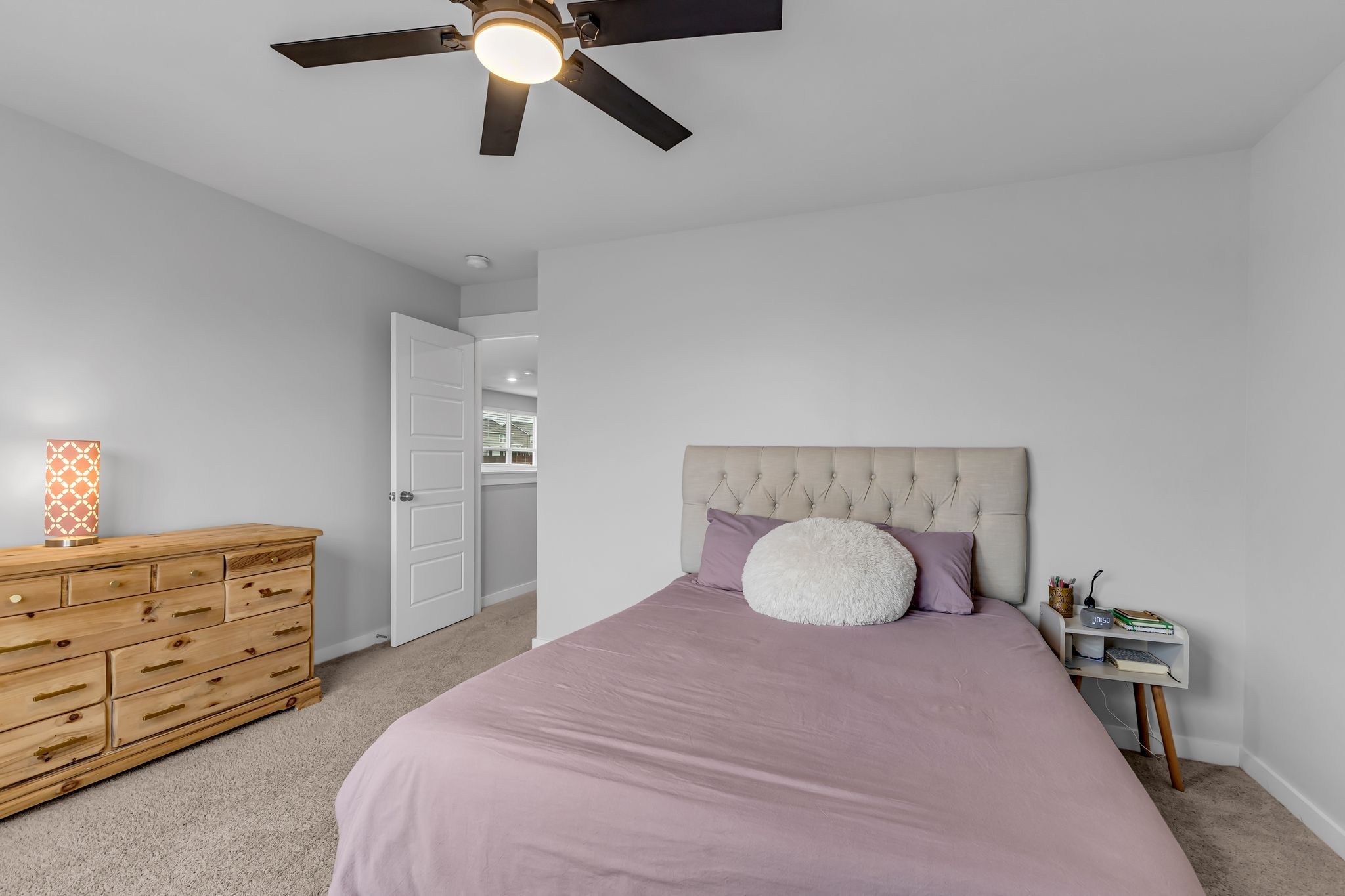 417 Irwin Way Spring Hill, TN 37174 - Photo 31 of 43 a bedroom with a bed and a chandelier