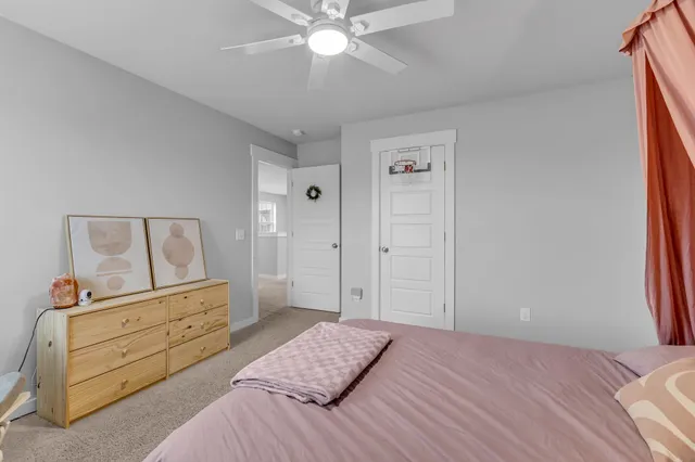 a bedroom with a bed and a dresser