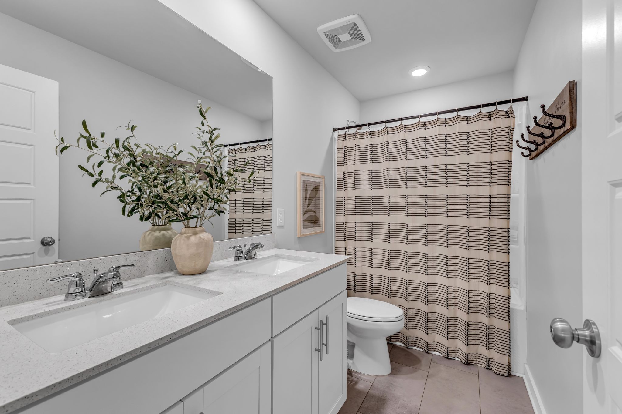 417 Irwin Way Spring Hill, TN 37174 - Photo 37 of 43 a bathroom with a granite countertop sink a toilet a mirror and shower