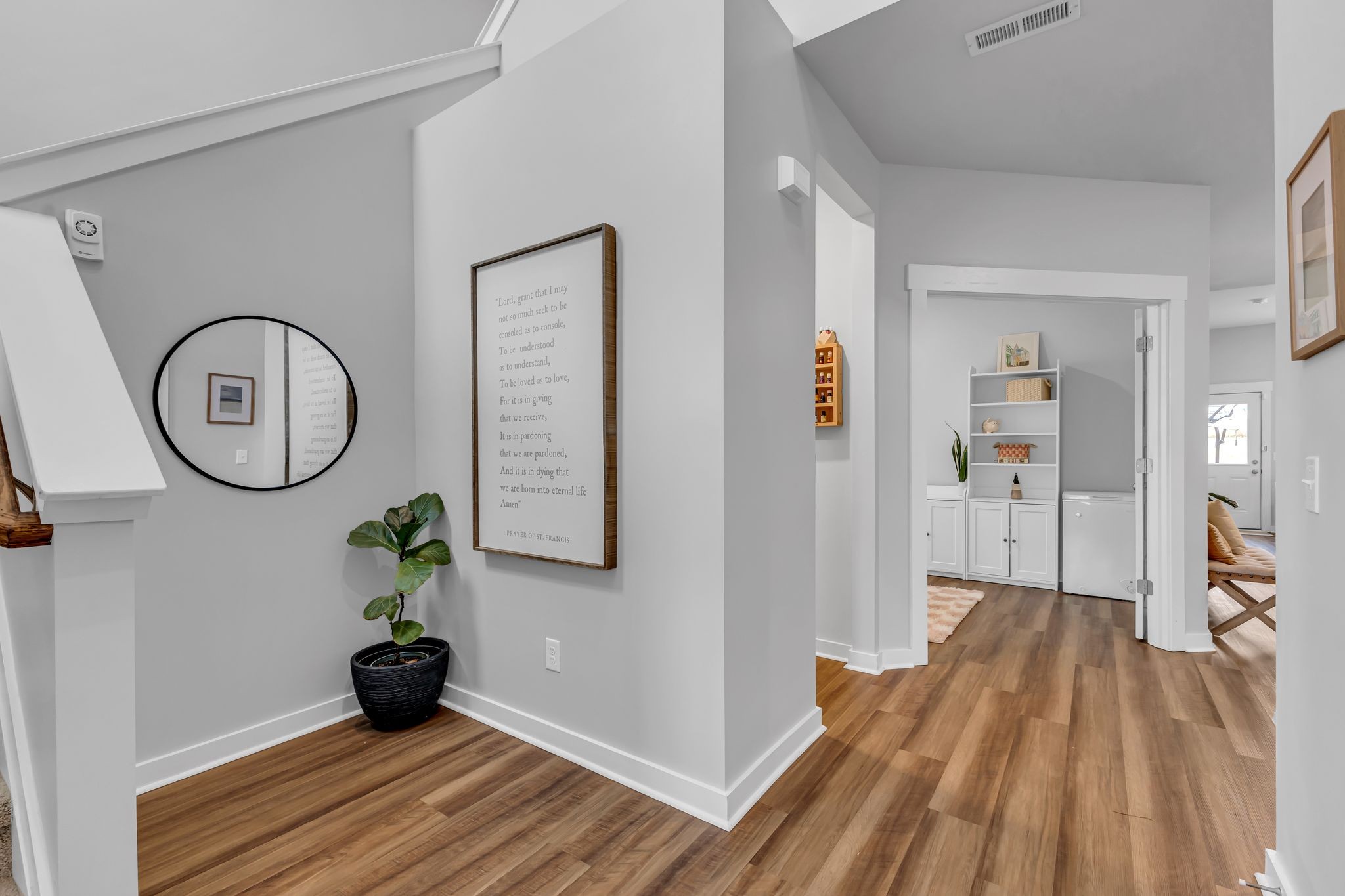 417 Irwin Way Spring Hill, TN 37174 - Photo 7 of 43 a view of a room with wooden floor and a ceiling fan