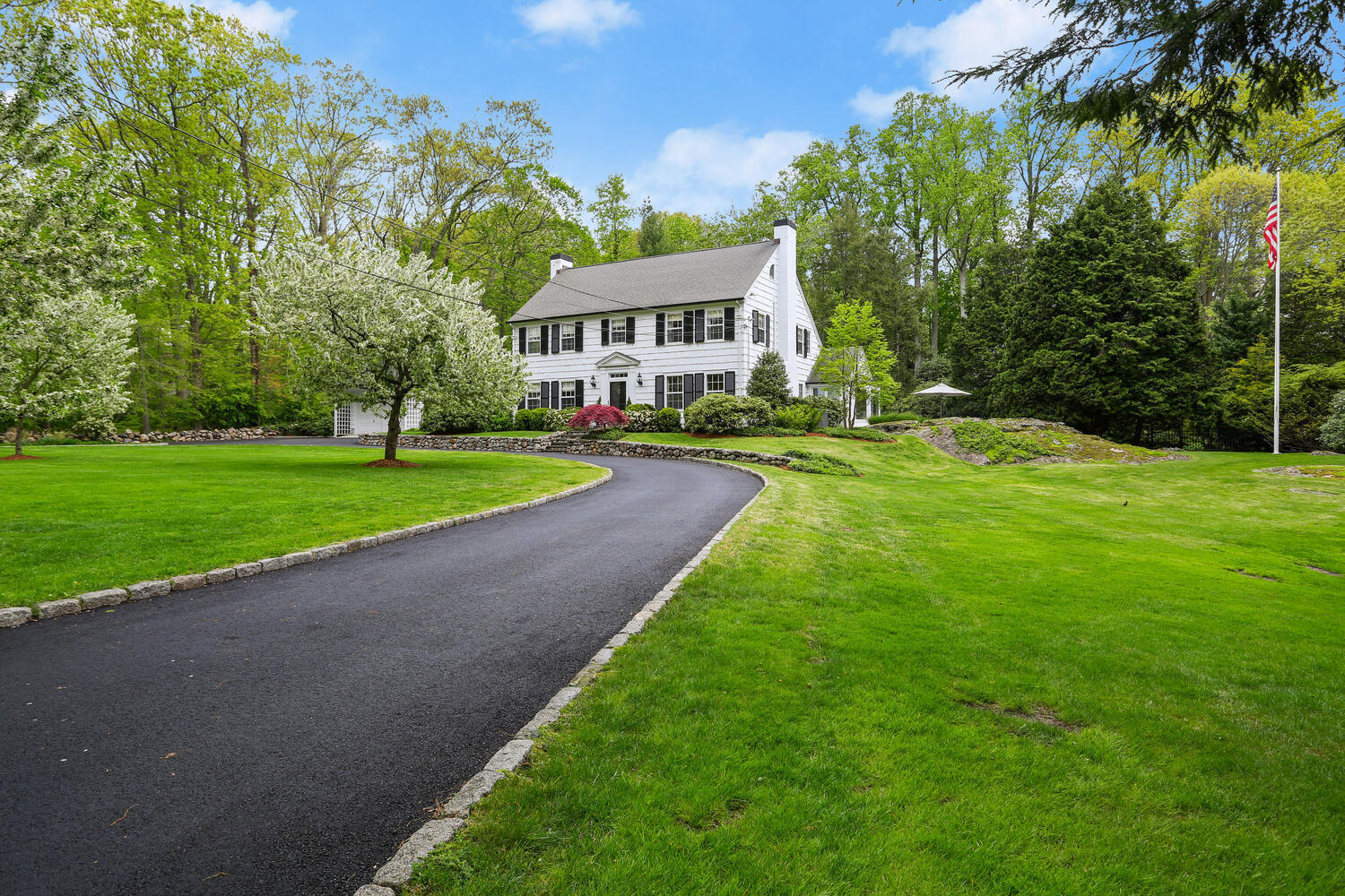 40 Birch Road Darien, CT 06820 - Photo 2 of 40 a front view of a house with yard and green space