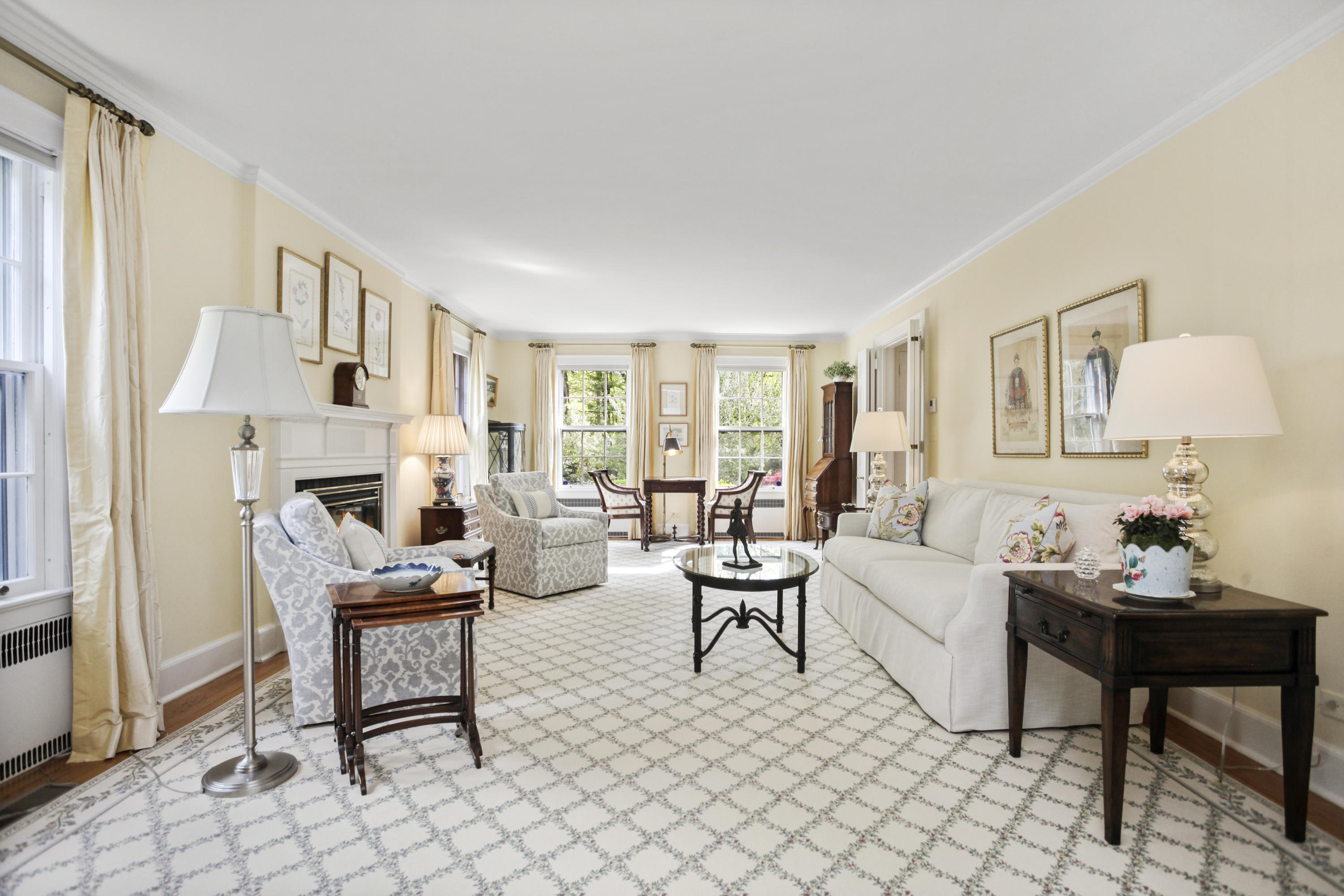 40 Birch Road Darien, CT 06820 - Photo 13 of 40 a living room with furniture a fireplace and a table