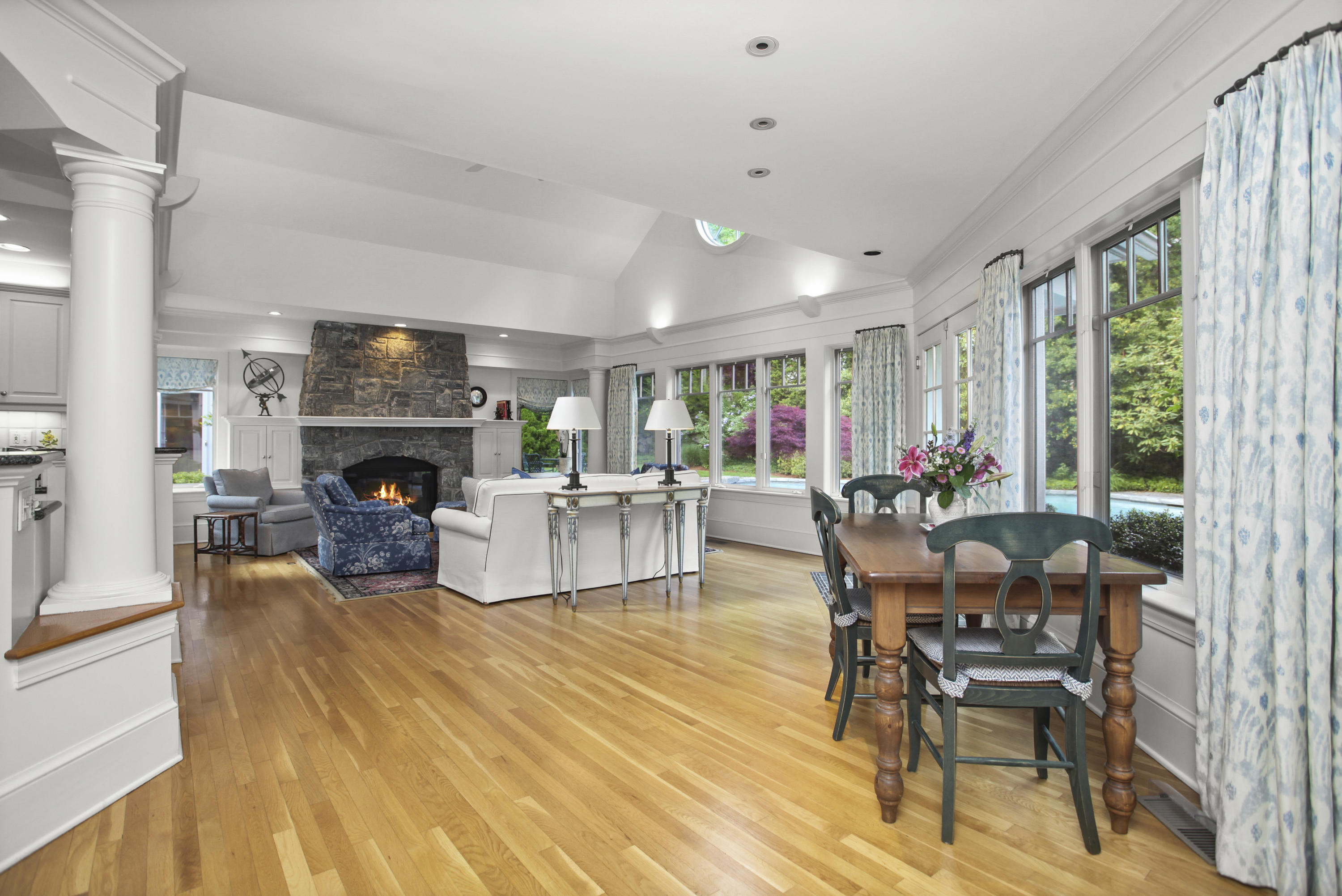 40 Birch Road Darien, CT 06820 - Photo 18 of 40 a living room with furniture a fireplace and a large window