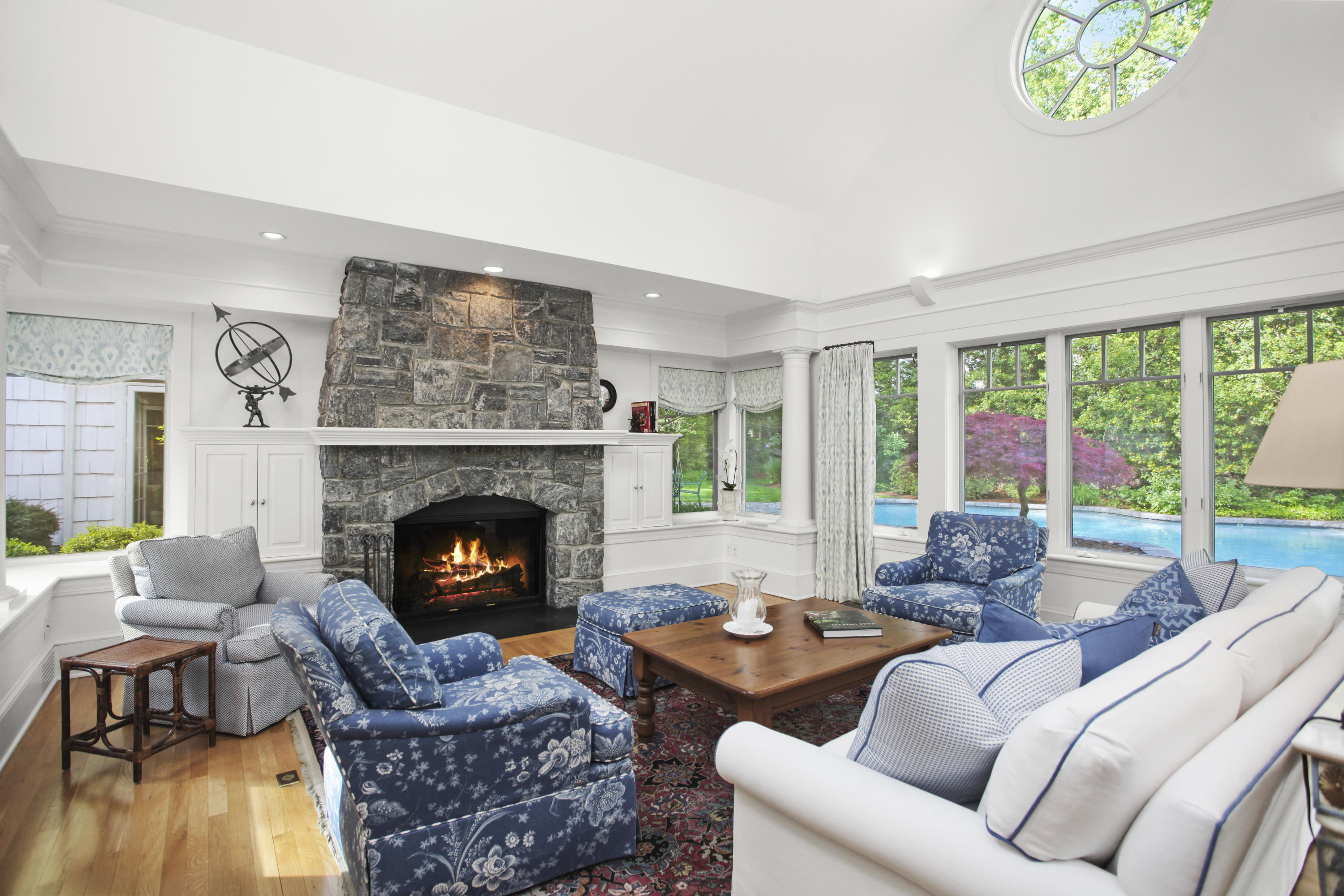 40 Birch Road Darien, CT 06820 - Photo 19 of 40 a living room with furniture and a fireplace