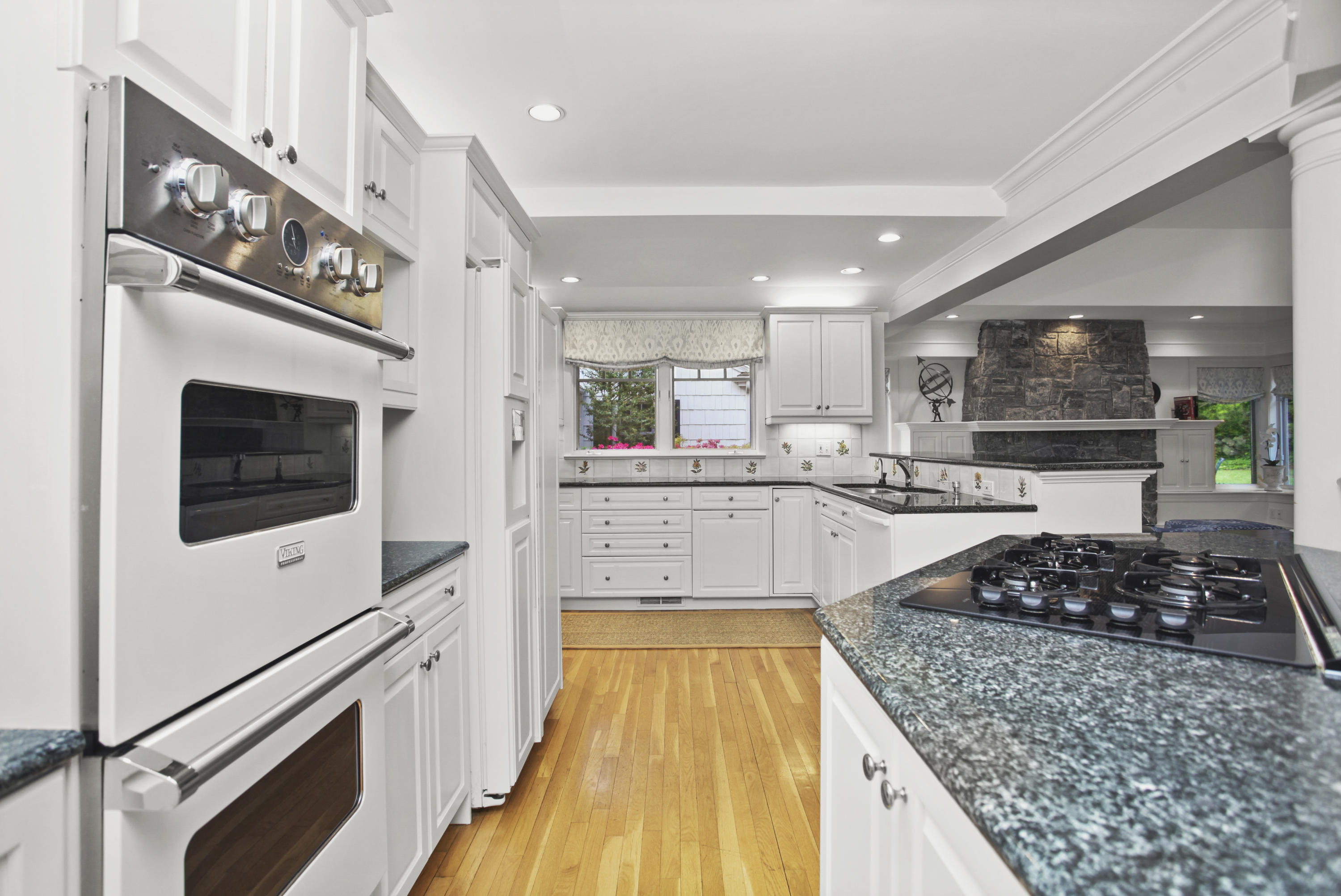 40 Birch Road Darien, CT 06820 - Photo 20 of 40 a kitchen with stainless steel appliances kitchen island granite countertop a stove and a sink