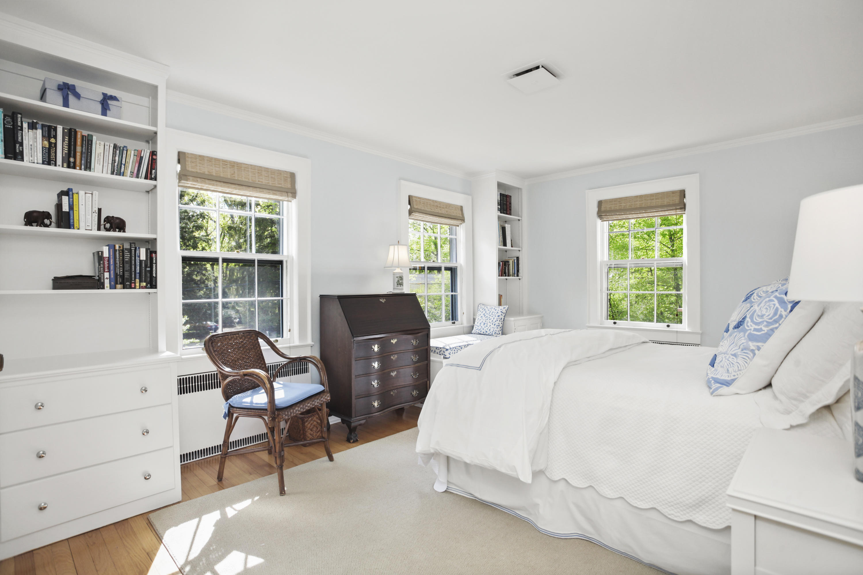 40 Birch Road Darien, CT 06820 - Photo 27 of 40 a bedroom with a bed a chair and next to a window