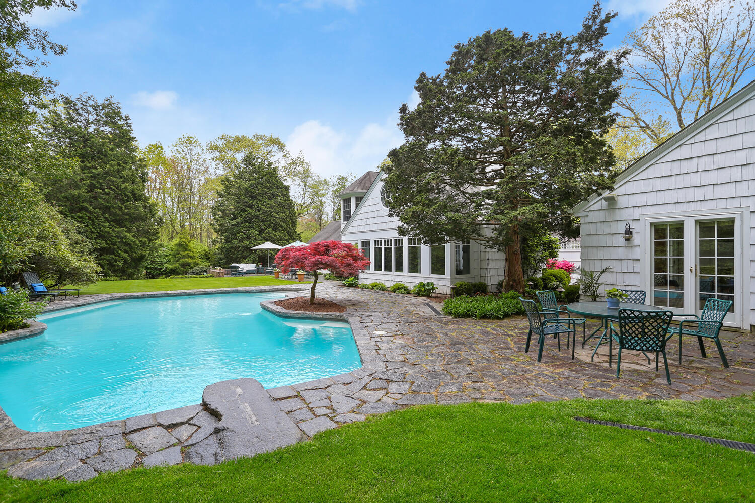 40 Birch Road Darien, CT 06820 - Photo 33 of 40 a front view of a house with garden