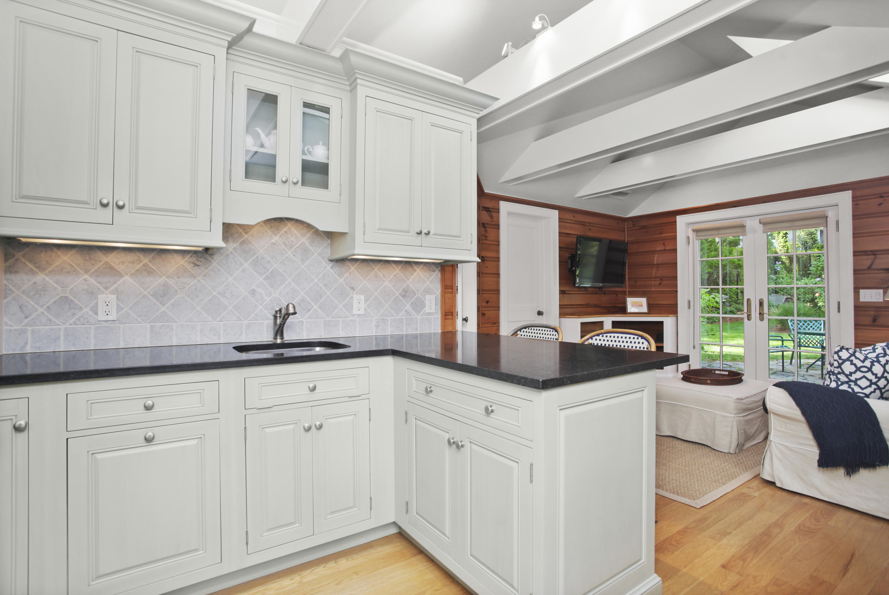 40 Birch Road Darien, CT 06820 - Photo 34 of 40 a kitchen with granite countertop a sink and cabinets