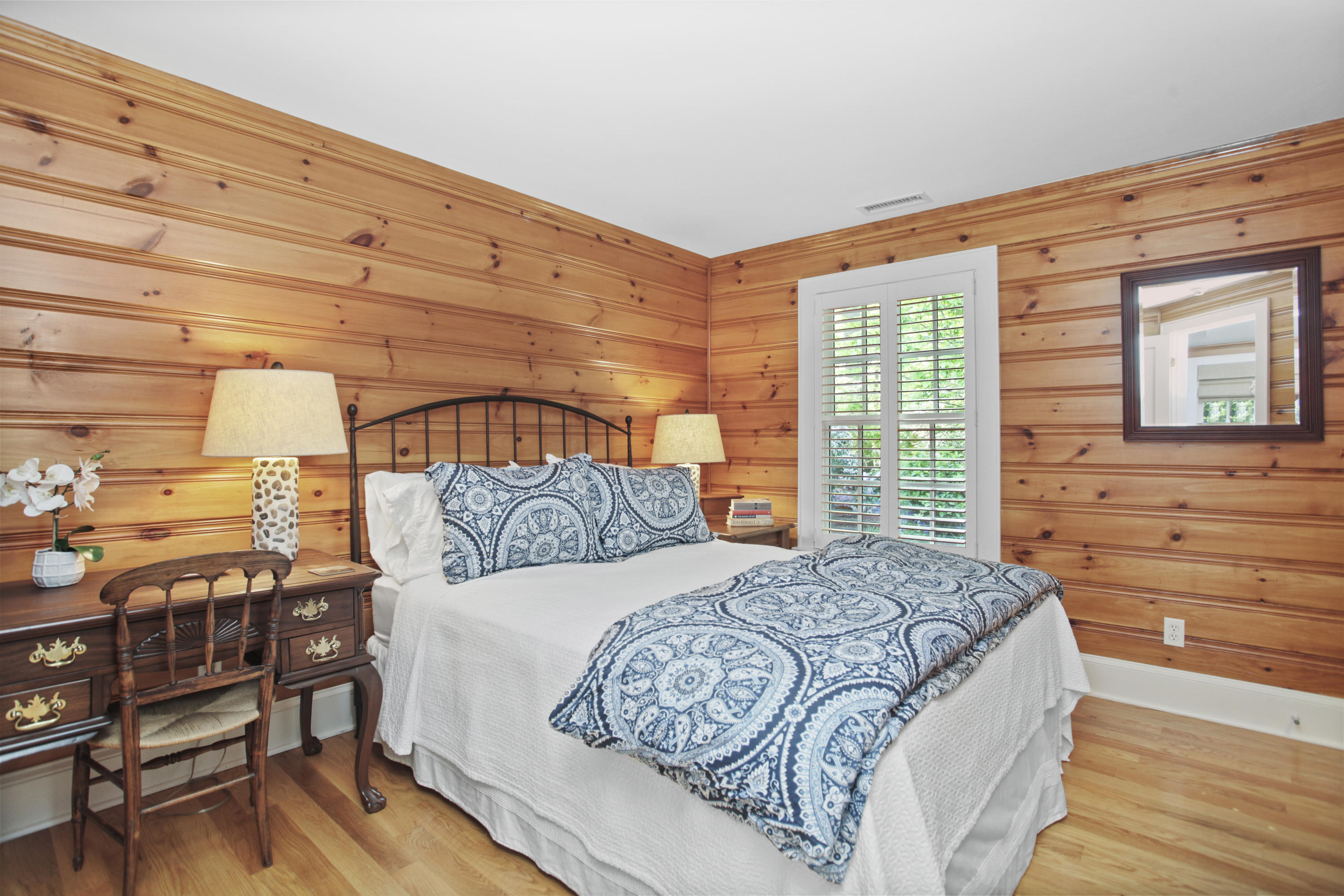 40 Birch Road Darien, CT 06820 - Photo 35 of 40 a bedroom with a bed and wooden floor