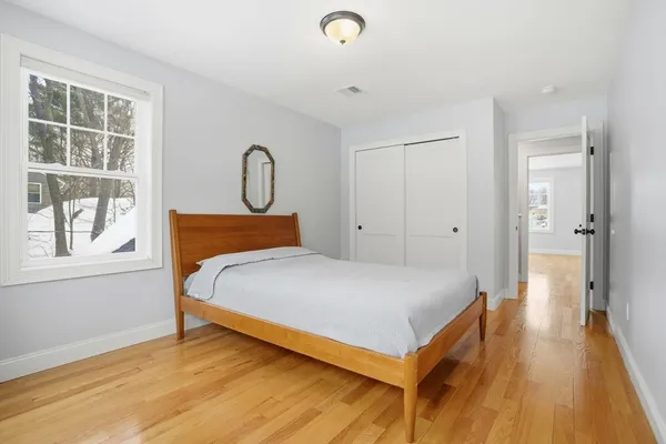 a bedroom with a bed and window