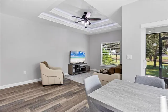 a bathroom with a granite countertop toilet a sink and a mirror