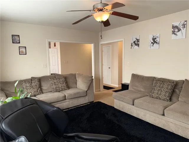 a living room with furniture and a couch