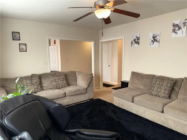 a living room with furniture and a couch