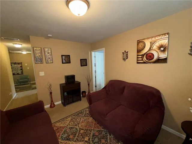 a living room with furniture and a couch