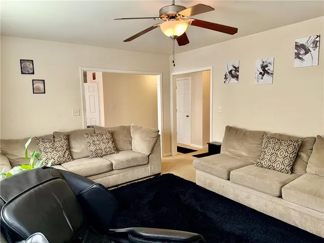 a living room with furniture and a couch