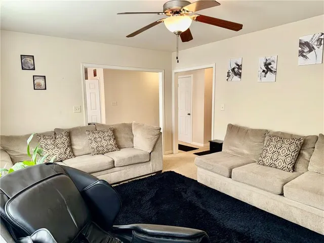a living room with furniture and a couch