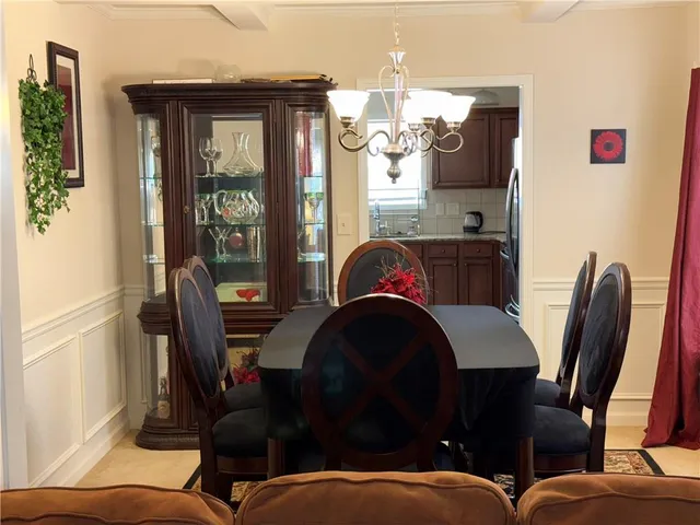 a dining room with furniture and window