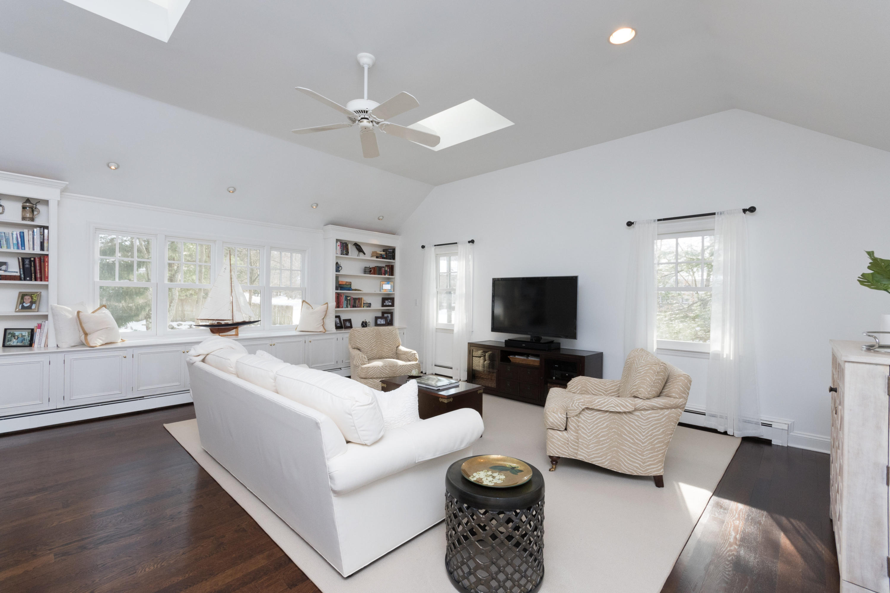 17 Country Club Road Darien, CT 06820 - Photo 12 of 37 a living room with furniture and a flat screen tv