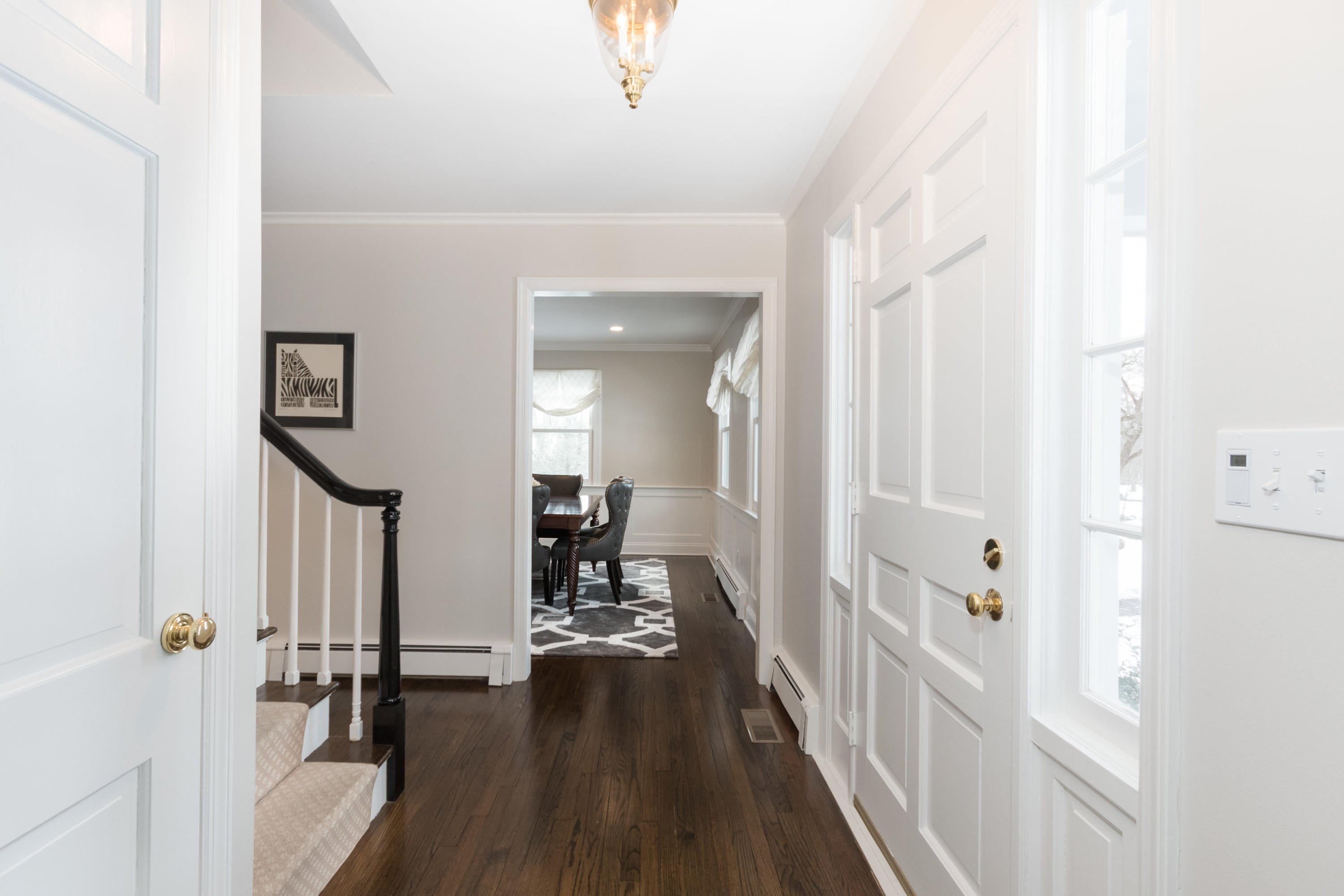 17 Country Club Road Darien, CT 06820 - Photo 2 of 37 a view of a hallway with wooden floor and windows