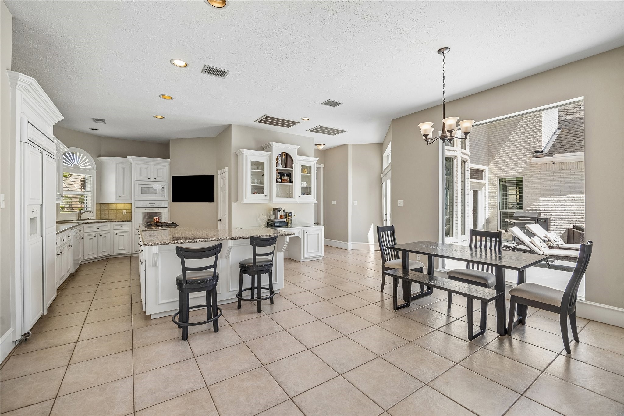 16407 Emilia Court Spring, TX 77379 - Photo 16 of 35 Long view into kitchen from adjacent den area,