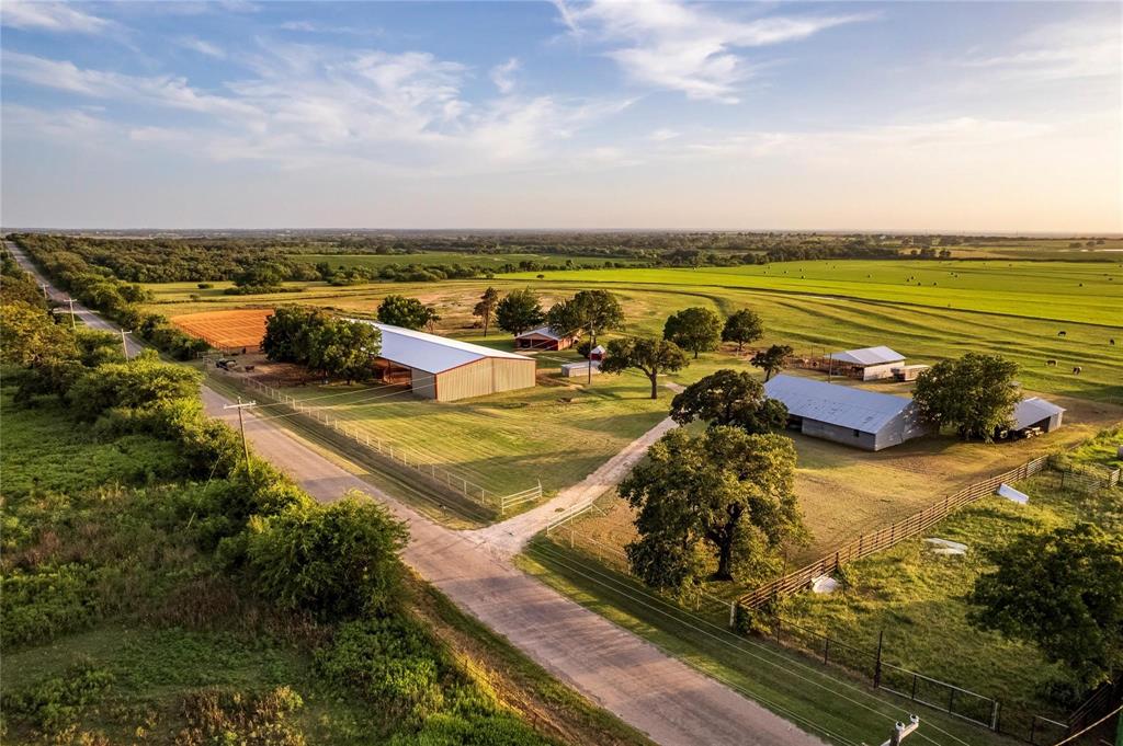 an aerial view of a residential houses with outdoor space