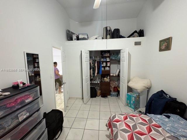 13521 Southwest 62nd Street, Unit 119 Miami, FL 33183 - Photo 14 of 19 a bedroom with a bed and a mirror