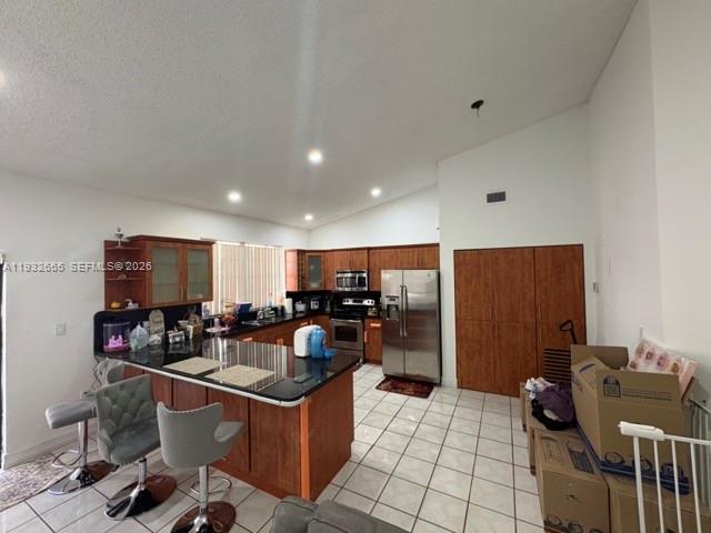 13521 Southwest 62nd Street, Unit 119 Miami, FL 33183 - Photo 4 of 19 a kitchen with stainless steel appliances kitchen island granite countertop a sink and cabinets