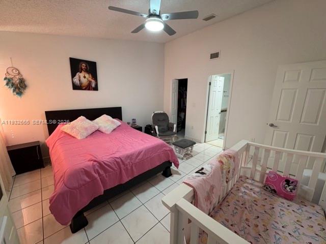 13521 Southwest 62nd Street, Unit 119 Miami, FL 33183 - Photo 8 of 19 a bed room with a bed and a lamp
