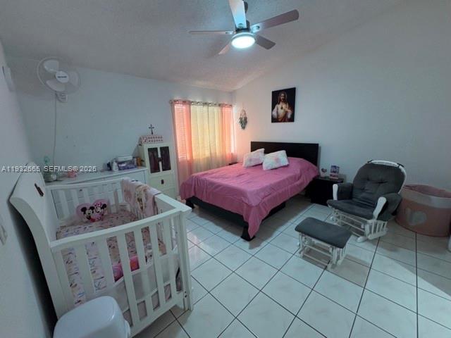 13521 Southwest 62nd Street, Unit 119 Miami, FL 33183 - Photo 9 of 19 a bedroom with furniture and a window