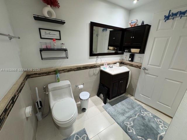 13521 Southwest 62nd Street, Unit 119 Miami, FL 33183 - Photo 10 of 19 a bathroom with a sink toilet and mirror
