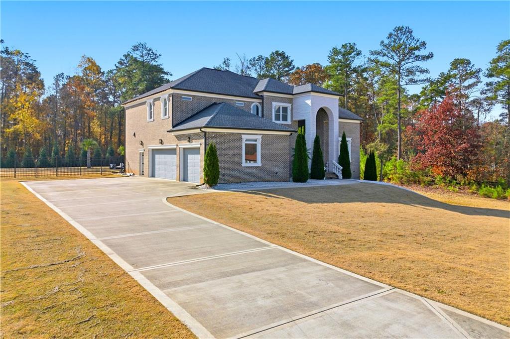 1616 Palmilla Way Southwest Stockbridge, GA 30281 - Photo 2 of 50 a front view of a house with a yard