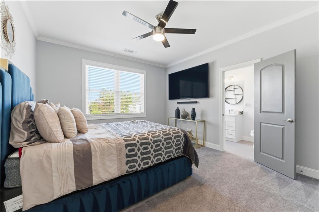 1616 Palmilla Way Southwest Stockbridge, GA 30281 - Photo 29 of 50 a bedroom with bed tv and window