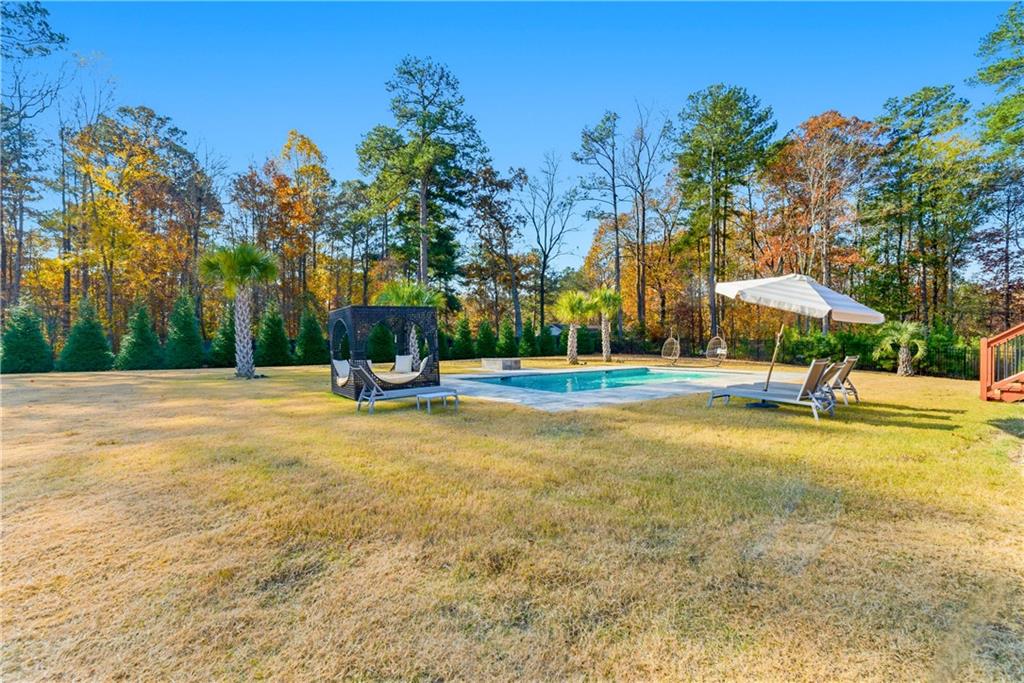 1616 Palmilla Way Southwest Stockbridge, GA 30281 - Photo 49 of 50 a view of a playground with basketball court