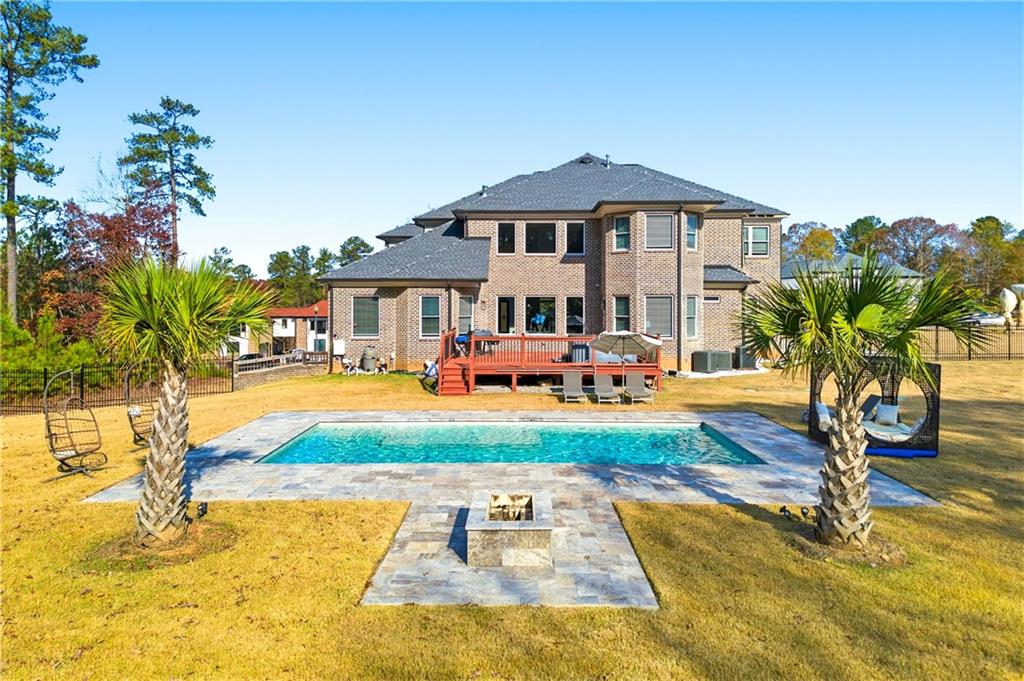 1616 Palmilla Way Southwest Stockbridge, GA 30281 - Photo 50 of 50 a front view of a house with swimming pool