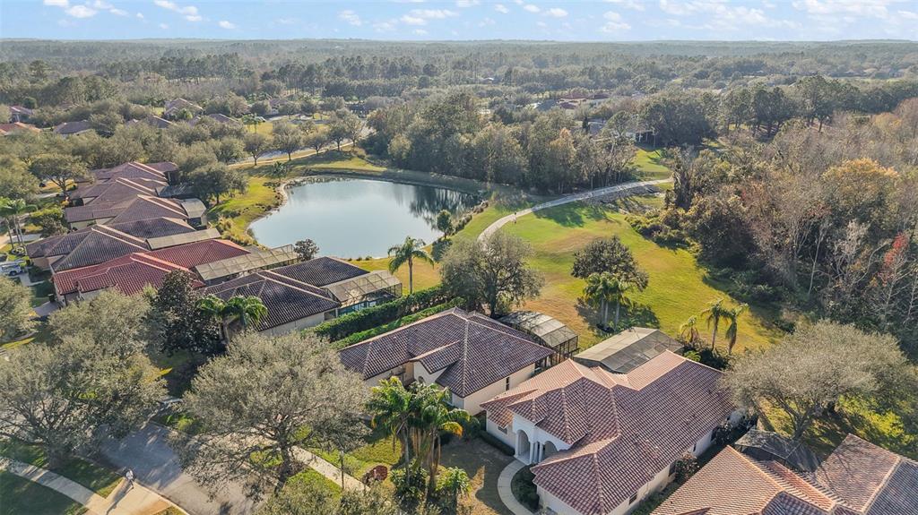 9930 Santa Barbara Court Howey-in-the-Hills, FL 34737 - Photo 36 of 44 an aerial view of residential houses with outdoor space and river