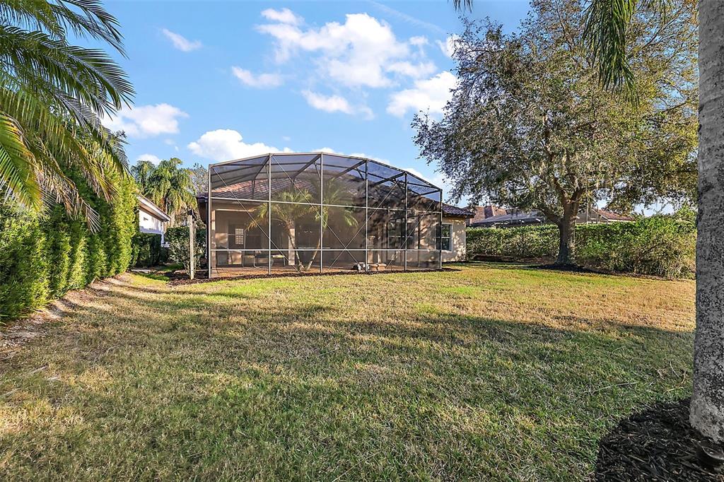9930 Santa Barbara Court Howey-in-the-Hills, FL 34737 - Photo 4 of 44 a view of a house with a yard
