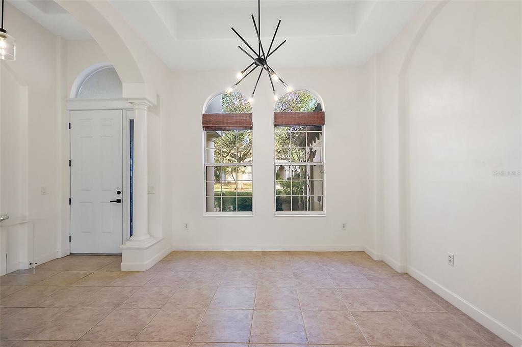 9930 Santa Barbara Court Howey-in-the-Hills, FL 34737 - Photo 8 of 44 an empty room with window
