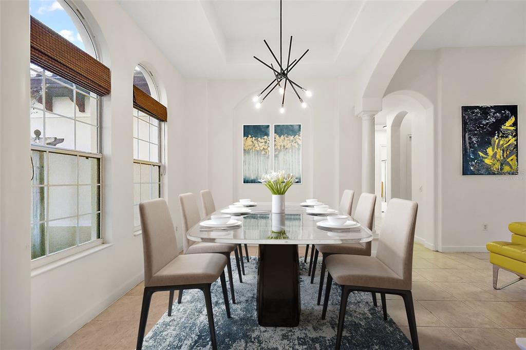 9930 Santa Barbara Court Howey-in-the-Hills, FL 34737 - Photo 10 of 44 a view of a dining room with furniture and window