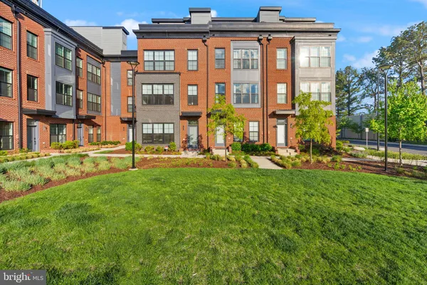 a view of a building with a yard