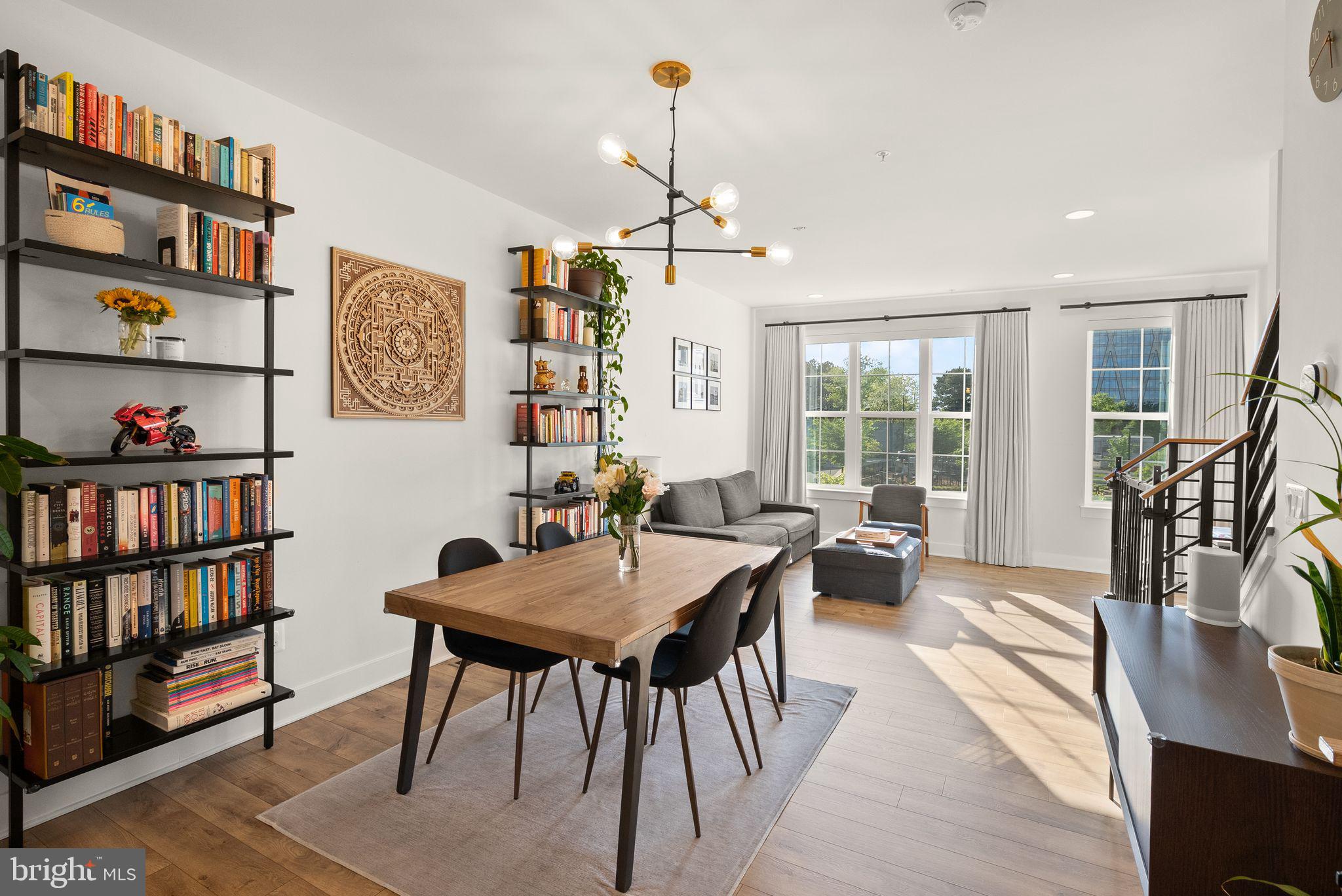 11258 Faraday Park Drive Reston, VA 20190 - Photo 2 of 44 a view of a dining room with furniture window and wooden floor