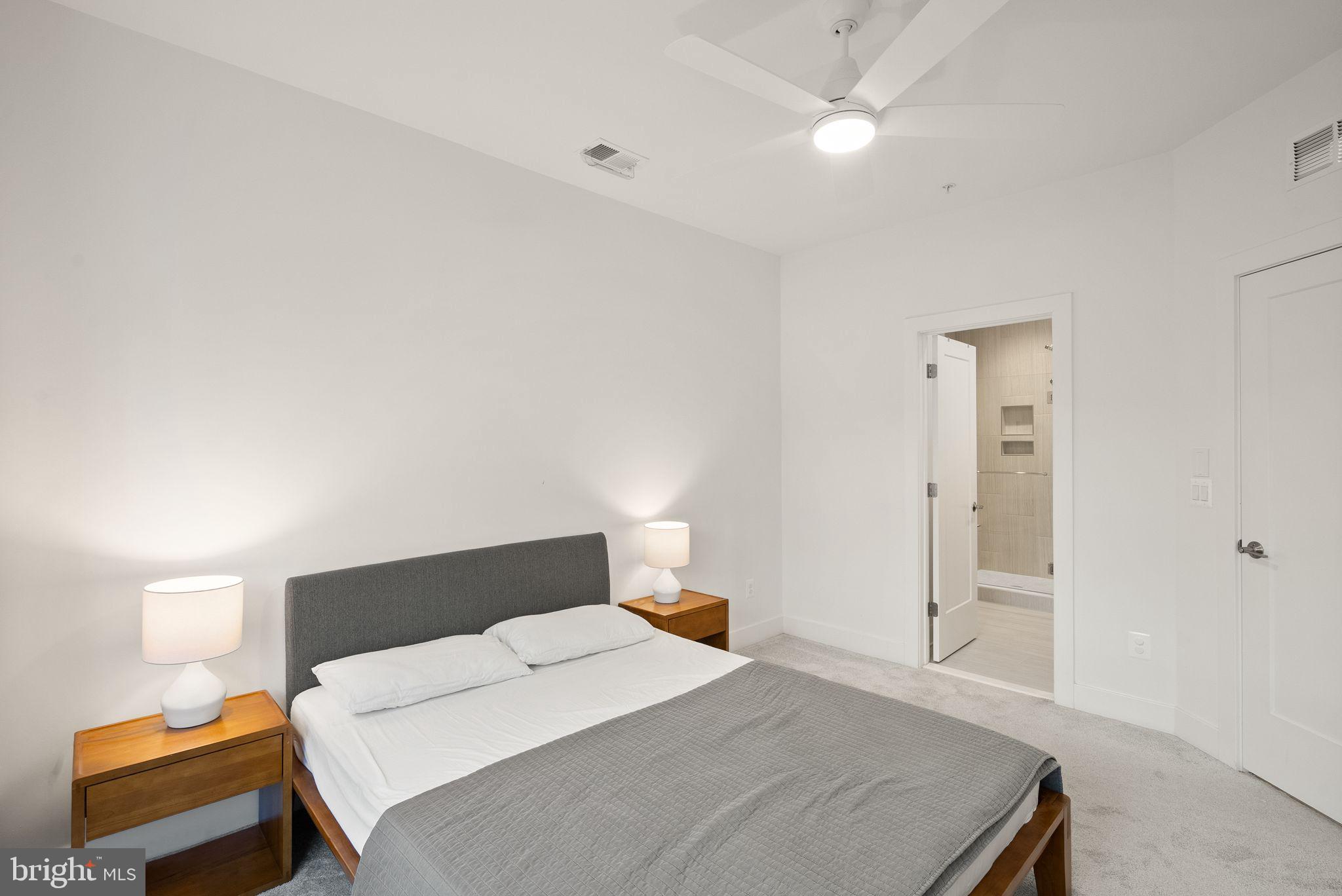 11258 Faraday Park Drive Reston, VA 20190 - Photo 23 of 44 a bedroom with a bed and a lamp with the table