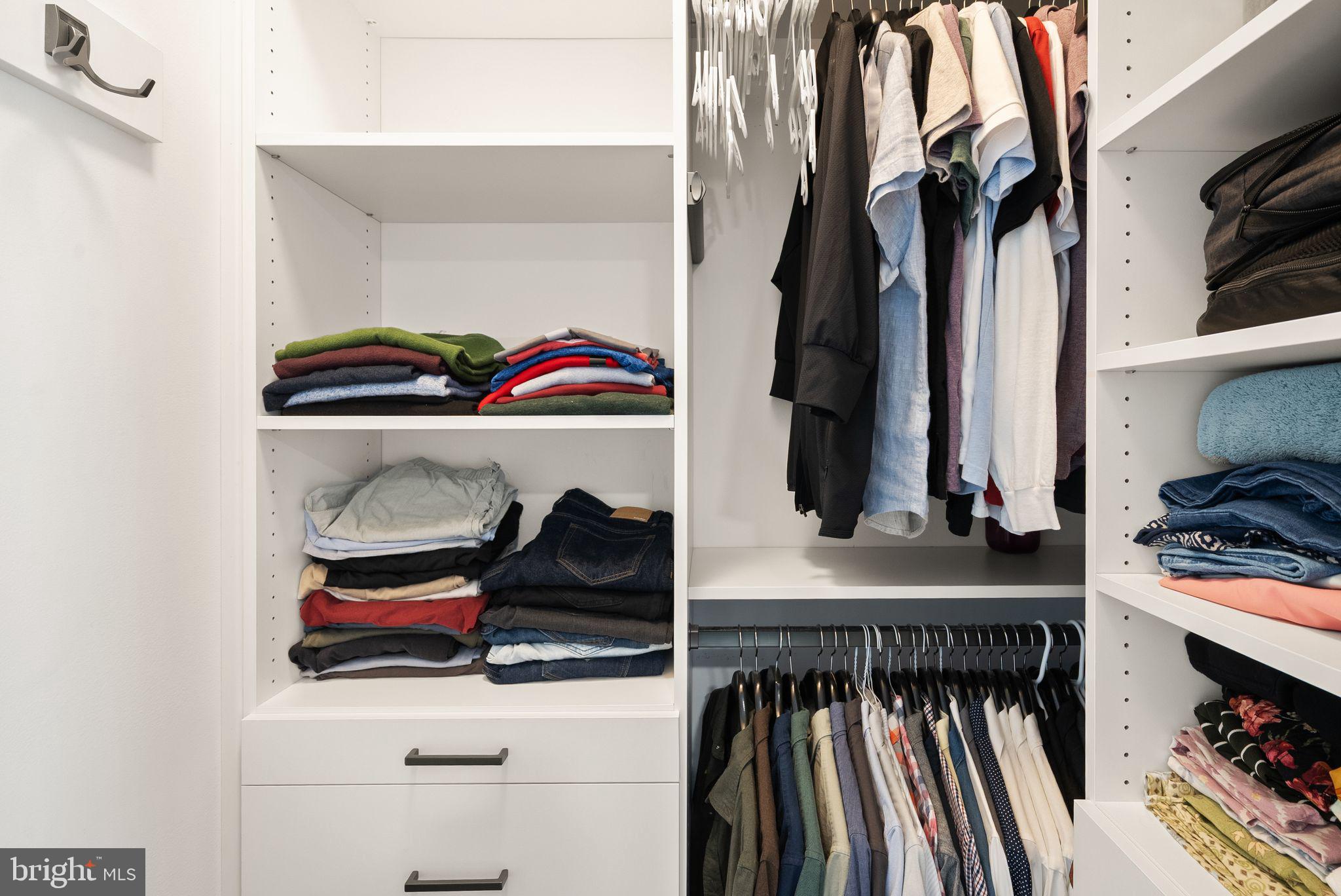 11258 Faraday Park Drive Reston, VA 20190 - Photo 25 of 44 a view of walk in closet with clothes and shoes