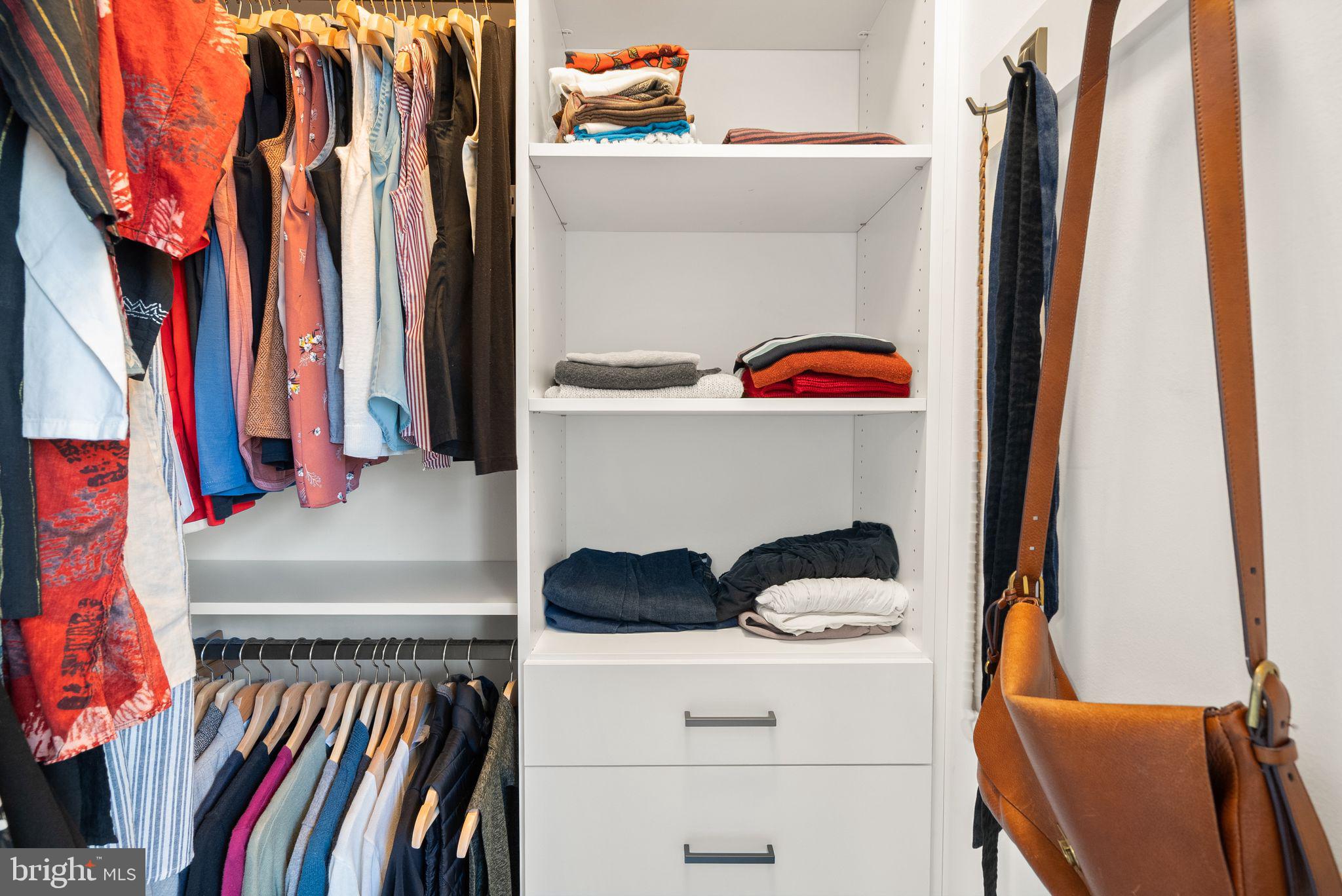 11258 Faraday Park Drive Reston, VA 20190 - Photo 26 of 44 a view of walk in closet with clothes and shoes