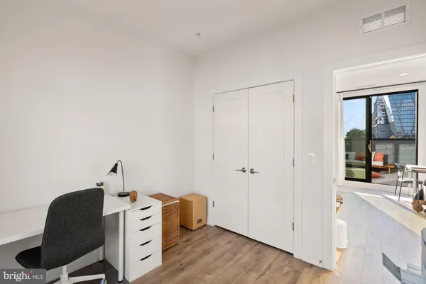 a living room with table and chairs